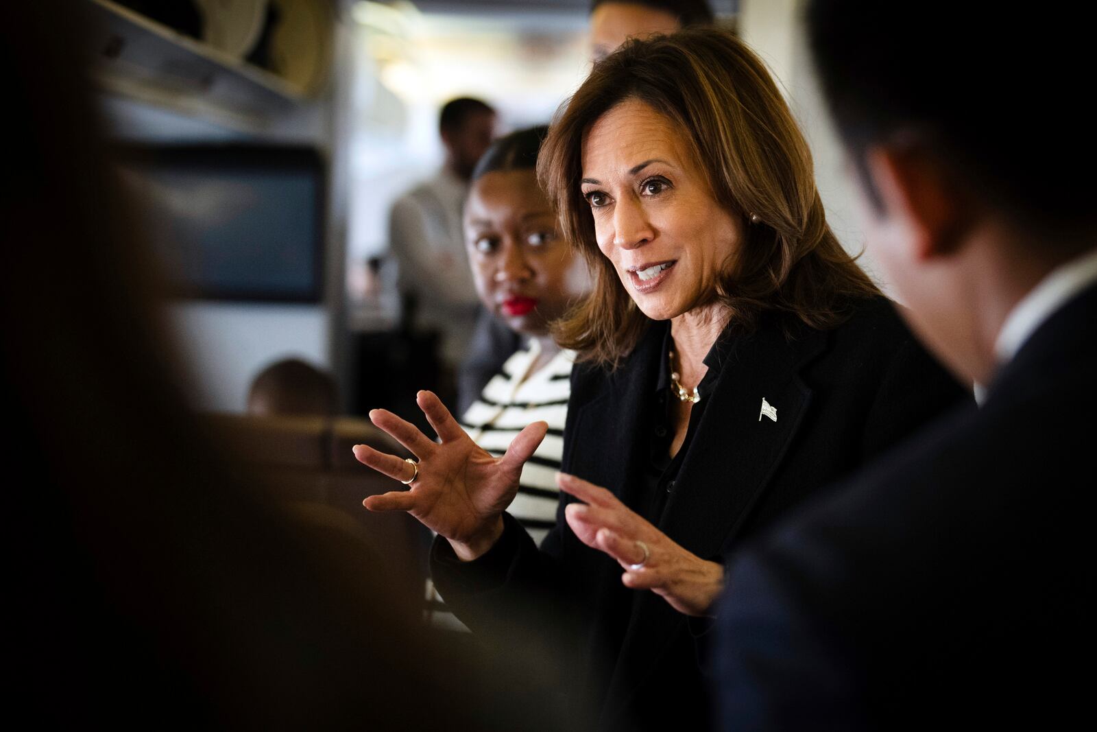 Democratic presidential candidate Vice President Kamala Harris talks to reporters aboard Air Force Two at Joint Base Andrews, Md., Wednesday, Oct. 23, 2024. (Erin Schaff//The New York Times via AP, Pool)