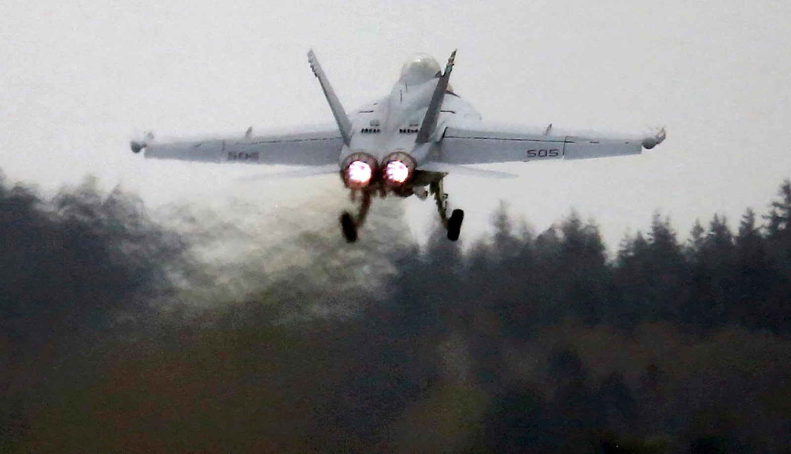 An EA-18G Growler takes off from Naval Air Station Whidbey Island during an exercise, March 10, 2016. (Ken Lambert/The Seattle Times via AP)