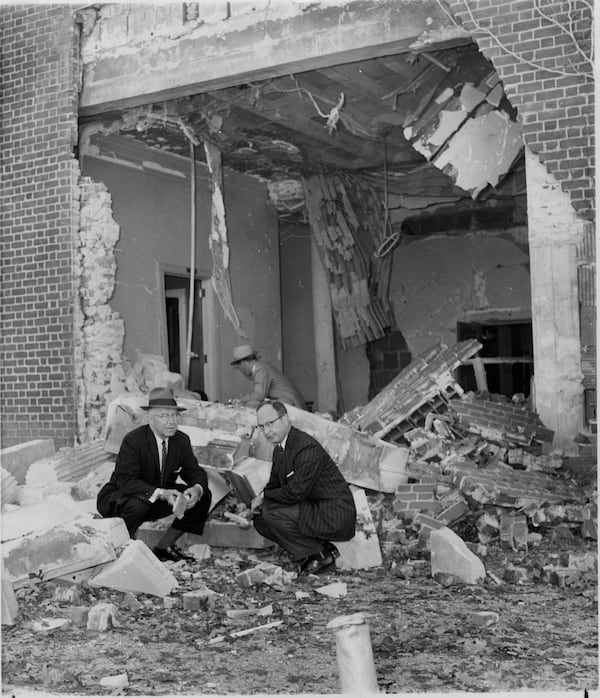 October 1958 - Atlanta, Ga - Mayor William Hartsfield and Rabbi Jacob Rothschild sift through rubble hours after The Temple was bombed. Civil leaders called the dynamiting 'stupid, vicious, senseless.'