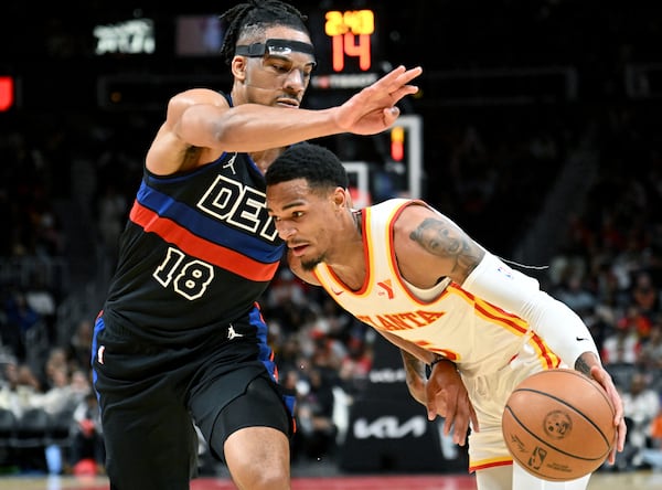 Atlanta Hawks guard Dejounte Murray (5) drives against Detroit Pistons guard Malachi Flynn (18) during the second half in an NBA basketball game at State Farm Arena, Wednesday, April 3, 2024, in Atlanta. Atlanta Hawks won 121 - 113 over Detroit Pistons. (Hyosub Shin / Hyosub.Shin@ajc.com)