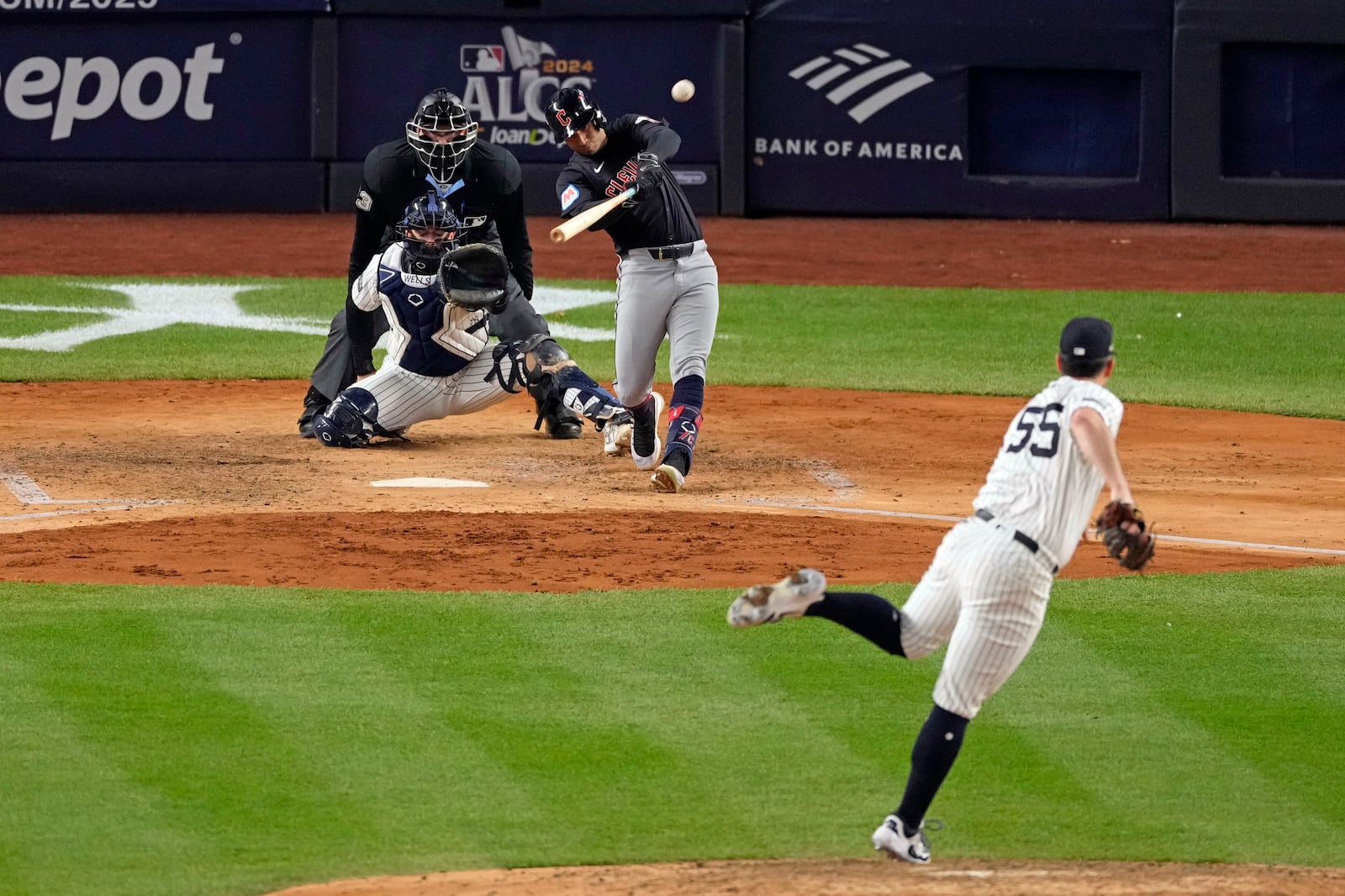 Cleveland Guardians' Brayan Rocchio, center, hits a home run off New York Yankees starting pitcher Carlos Rodón (55) during the sixth inning in Game 1 of the baseball AL Championship Series Monday, Oct. 14, 2024, in New York. (AP Photo/Seth Wenig)