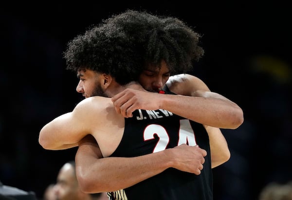 Georgia's Jaden Newell (24) and Asa Newell hug after an 89-68 loss against Gonzaga in the first round of the NCAA Tournament at INTRUST Arena on Thursday, March 20, 2025, in Wichita, Kansas. (Jamie Squire/Getty Images/TNS)