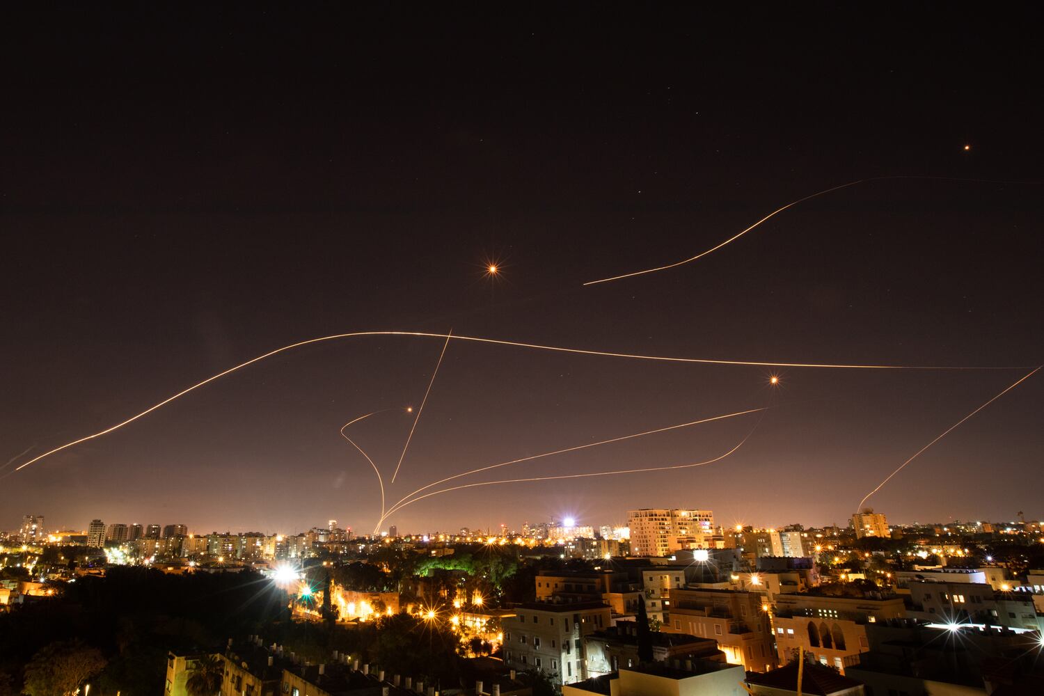 IsraelÕs Iron Dome missile defense system intercepts rockets launched into Tel Aviv from the Gaza Strip, May 16, 2021. (Corinna Kern/The New York Times)