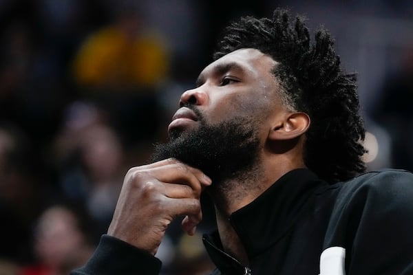 Philadelphia 76ers' Joel Embiid watches from the bench during the second half of an NBA basketball game against the Indiana Pacers, Sunday, Oct. 27, 2024, in Indianapolis. (AP Photo/Darron Cummings)