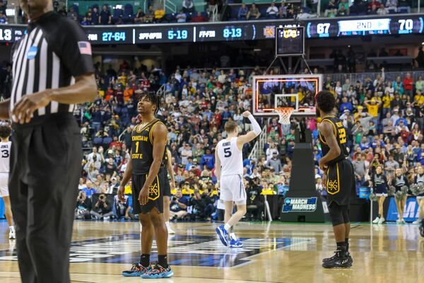 Kennesaw State guard Terrell Burden (1) reacts as time expires as Xavier guard Adam Kunkel (5) celebrates during the first round of the NCAA Tournament at the Greensboro Coliseum, Friday, March 17, 2023, in Greensboro, NC. Kennesaw State lost 72-67 against Xavier. Jason Getz / Jason.Getz@ajc.com)
