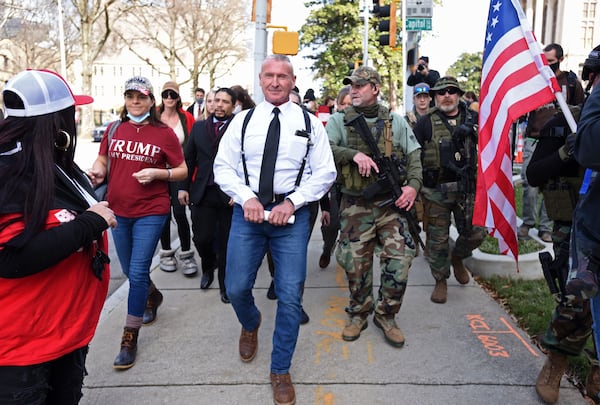  Chester Doles (center), president of American Patriots USA, holding a letter, leads a group of protesters before he delivers the letter inside the Georgia State Capitol during Stop the Still rally organized by American Patriots USA outside the Georgia State Capitol on Wednesday, Jan. 6, 2021. (Hyosub Shin / Hyosub.Shin@ajc.com)