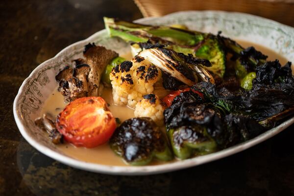 At Nur Kitchen, the charm of the seasonal vegetable plate isn't just the veggies; the buttery sauce is memorable, too. (Mia Yakel for The Atlanta Journal-Constitution)