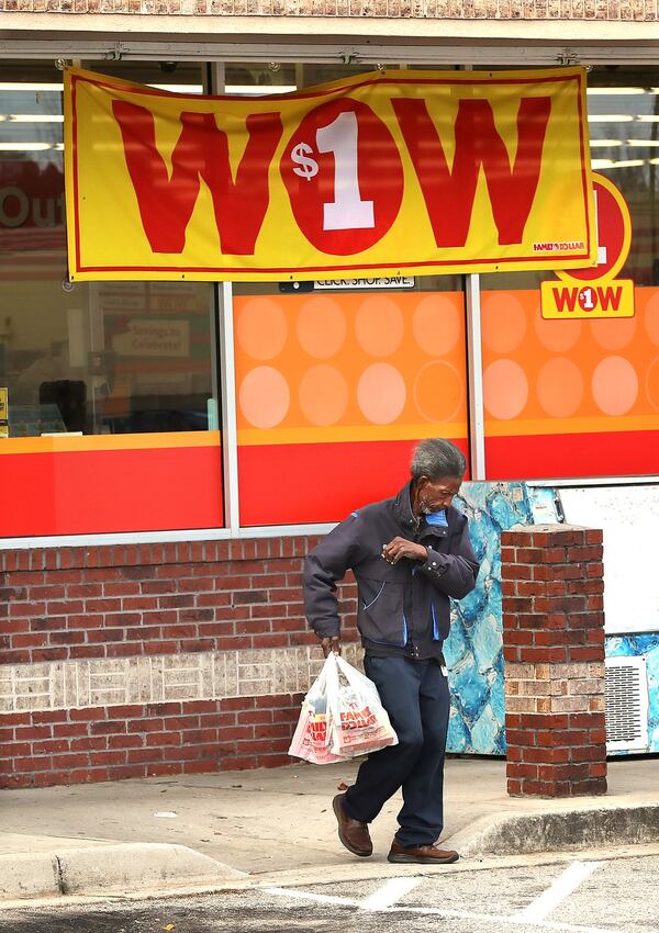 A customer leaves the Family Dollar at the intersection of Covington Highway and Dekalb Medical Parkway. Curtis Compton/ccompton@ajc.com