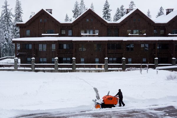 A worker clears a road with a snow blower during a storm Thursday, Nov. 21, 2024, at Sugar Bowl Ski Resort in Norden, Calif. (AP Photo/Brooke Hess-Homeier)