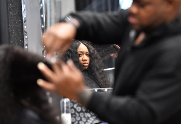 Celebrity hairstylist Derek J. styles his client Miracle Jenkins’ hair at J Spot Hair Salon on Thursday, Feb. 2, 2023, in Buckhead. (Hyosub Shin/AJC)