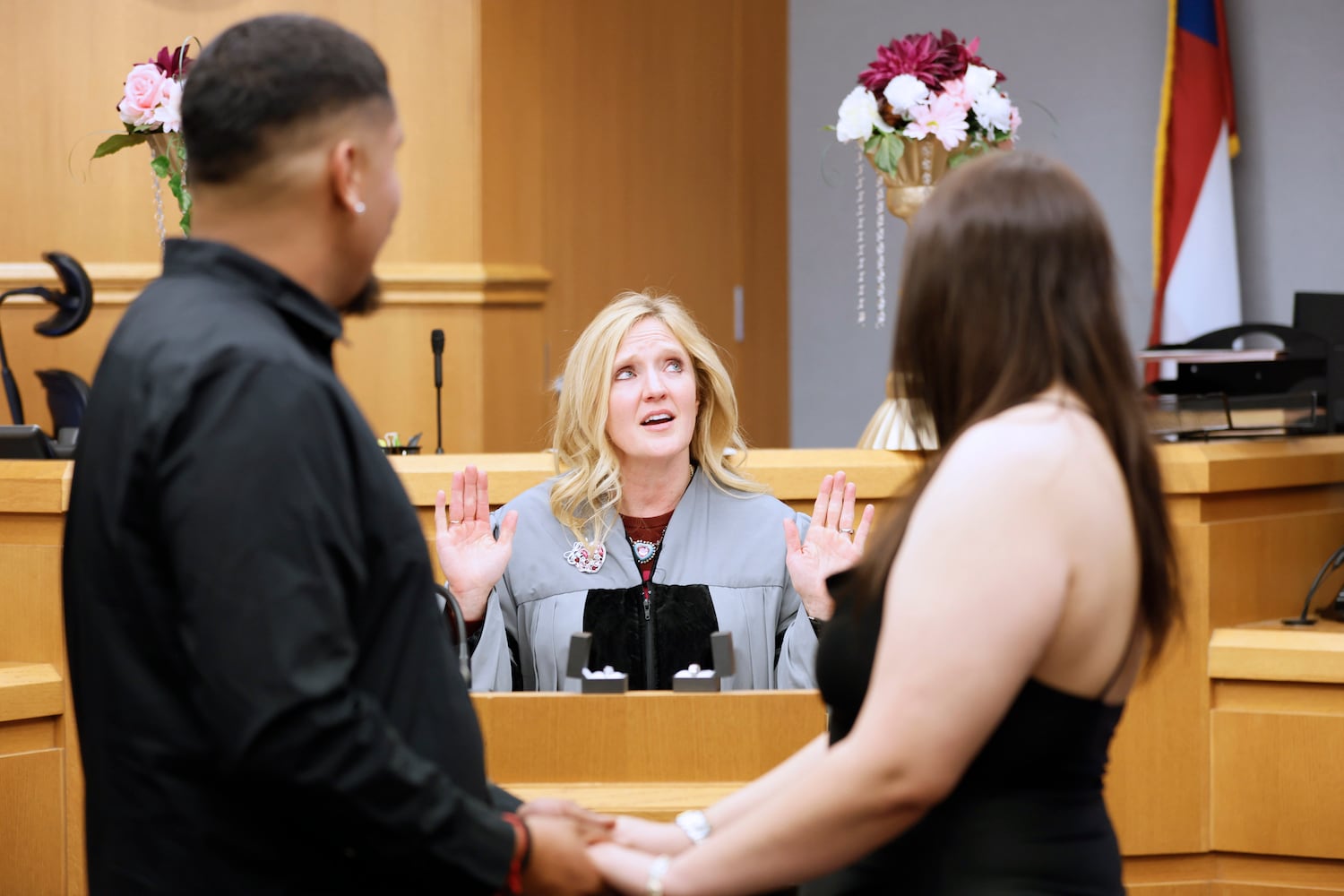 Chief Magistrate Judge Kristina Hammer Blum reacts as she presides over the wedding of Jonathan López and Alma Escobar in Courtroom 1C of the Gwinnett County Courthouse in Lawrenceville on Valentine’s Day, Tuesday, February 14, 2023. Miguel Martinez / miguel.martinezjimenez@ajc.com