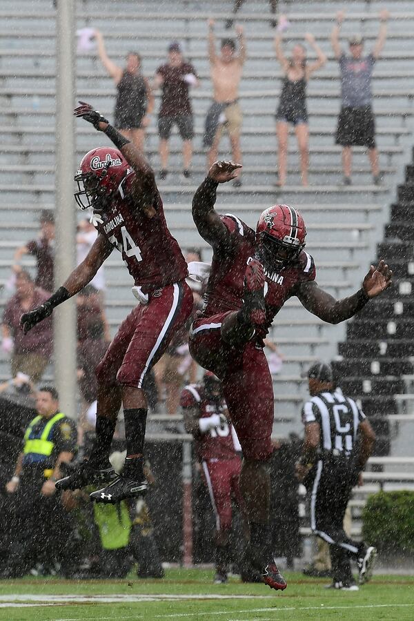 COLUMBIA, SC - OCTOBER 06: Defensive back Israel Mukuamu #24 and defensive lineman Javon Kinlaw #3 of the South Carolina Gamecocks celebrate after the Gamecocks score a touchdown off of an intercepted pass against the Missouri Tigers during the football game at Williams-Brice Stadium on October 6, 2018 in Columbia, South Carolina. (Photo by Mike Comer/Getty Images)