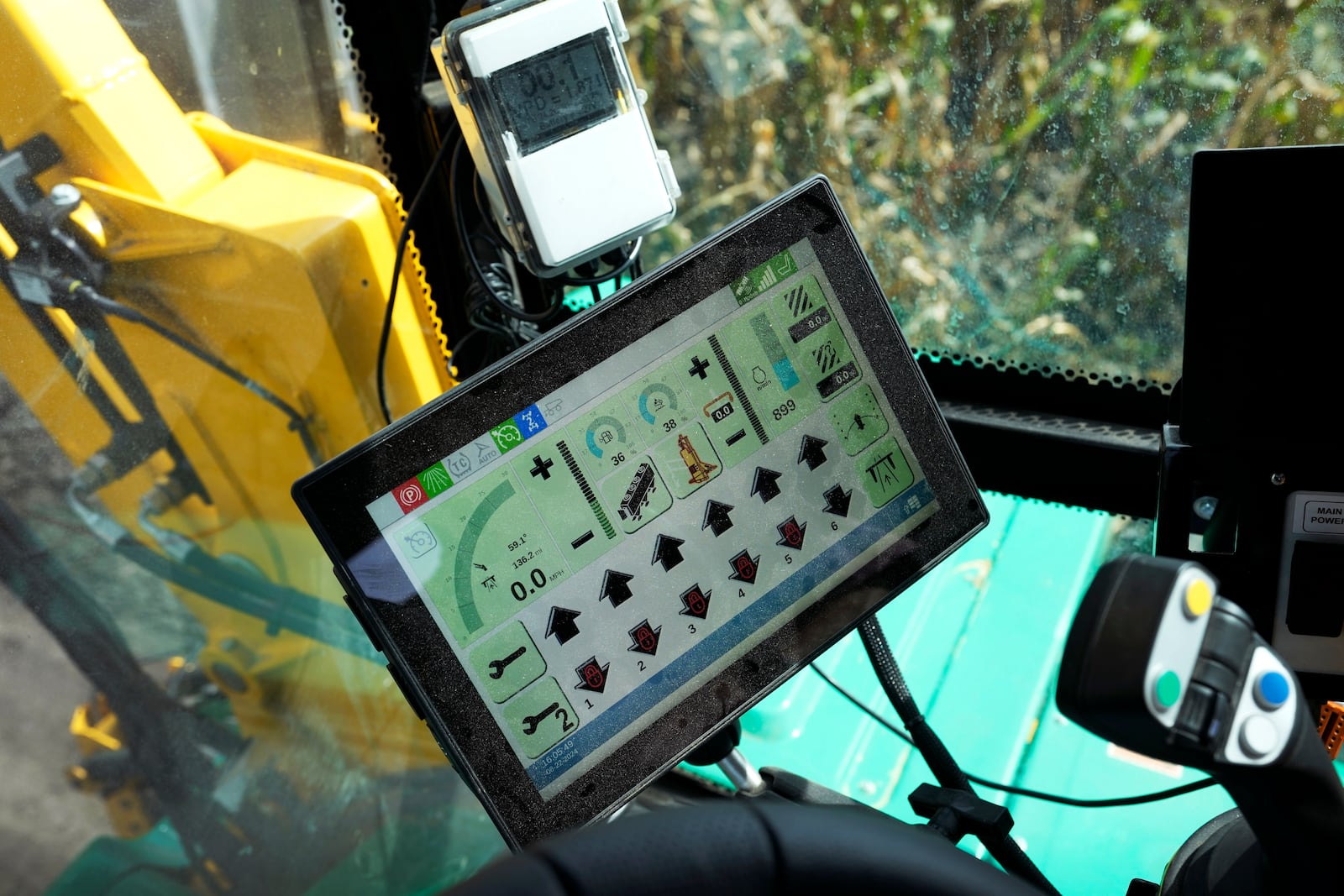 A computer screen inside a PowerPollen collector shows data after being driven through a cornfield, Thursday, Aug. 22, 2024, near Ames, Iowa. (AP Photo/Charlie Neibergall)