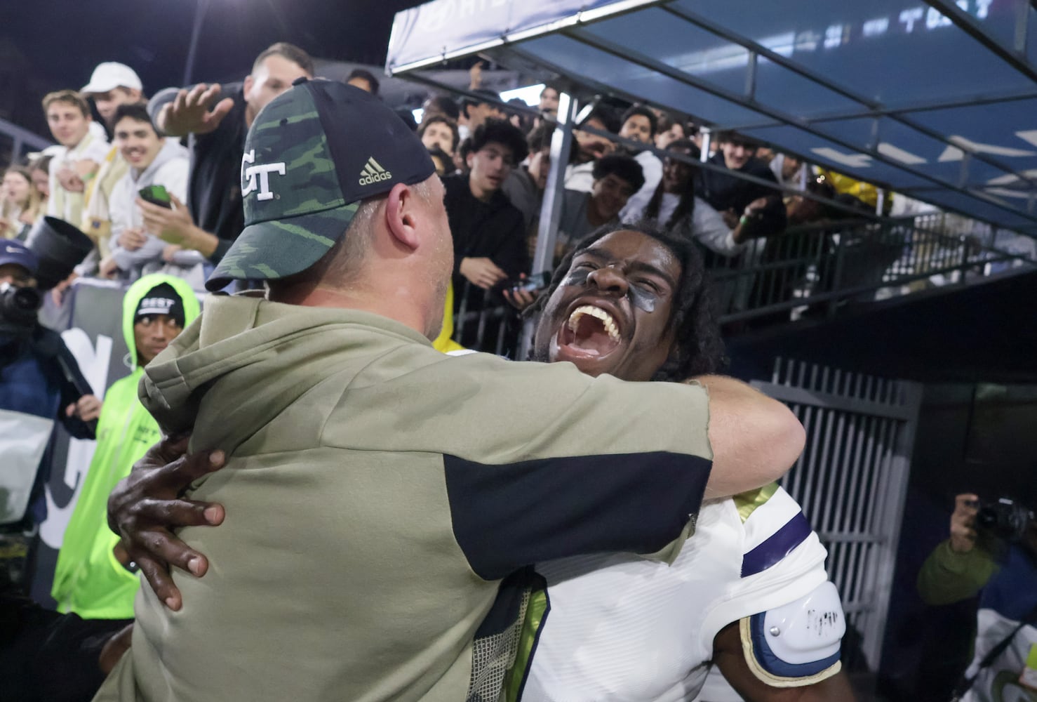 Georgia Tech head coach Brent Key hugs wide receiver Avery Boyd after Tech won an NCAA college football game against Syracuse in Atlanta on Saturday, Nov. 18, 2023.  Georgia Tech won 31 - 22. (Bob Andres for the Atlanta Journal Constitution)