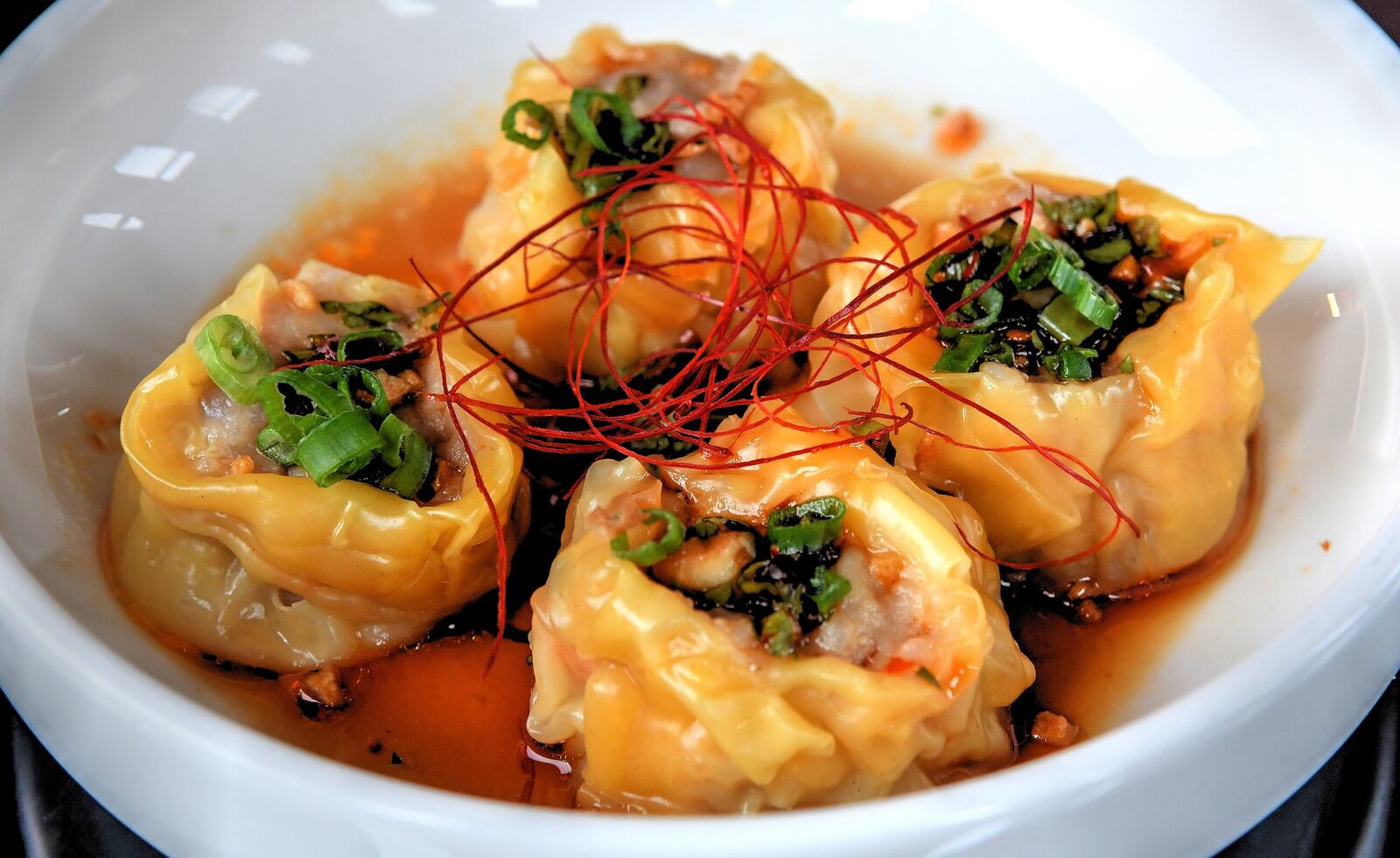 Shumai, shrimp and pork dumplings, dried fresno chili, sweet soy vinaigrette. CONTRIBUTED BY CHRIS HUNT PHOTOGRAPHY