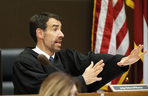 Fulton County Chief Judge Robert McBurney discusses questions from the jury with attorneys during the Tex McIver murder trial at the Fulton County Courthouse on Thursday, April 12, 2018. (Bob Andres bandres@ajc.com)