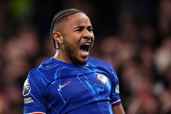 Chelsea's Christopher Nkunku celebrates scoring their side's first goal of the game during the English Premier League soccer match between Chelsea and Southampton at Stamford Bridge, London, Tuesday, Feb. 25, 2025. (John Walton/PA via AP)