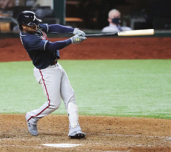 Braves' Ozzie Albies hits a 2-run homer during the 9th inning.   “Curtis Compton / Curtis.Compton@ajc.com”