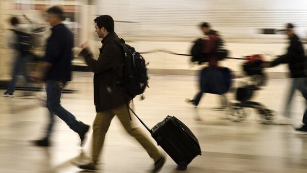 Travelers gather in a waiting room at Amtrak's Baltimore Penn Station, Tuesday, Nov. 20, 2018, in Baltimore.