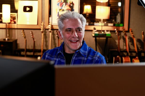 Rick Beato smiles while watching footage from his appearance on AMC’s The Talking Dead while editing a new episode for his Youtube channel on Thursday, November 10, 2022. (Natrice Miller/natrice.miller@ajc.com)  