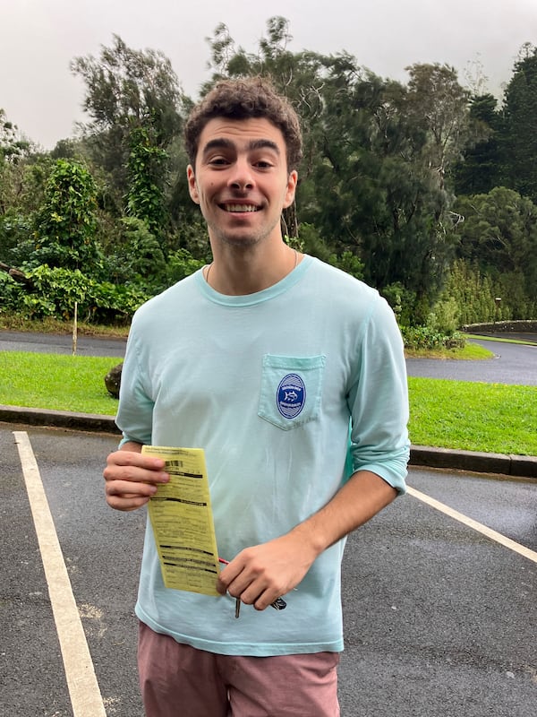 This photo, provided by the Hawaii Dept. of Land and Natural Resources, shows Luigi Mangione, a suspect in the fatal shooting of UnitedHealthcare CEO Brian Thompson, receiving a citation for failing to observe a posted closed-area sign, in Honolulu, Sunday, Nov. 12, 2023. (Hawaii Dept. of Land and Natural Resources via AP)