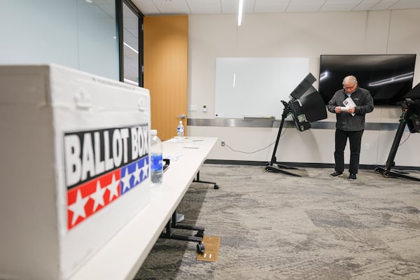 A voter casts a ballot during early voting in Waukesha, Wis., Tuesday, March 18, 2025. (AP Photo/Jeffrey Phelps)