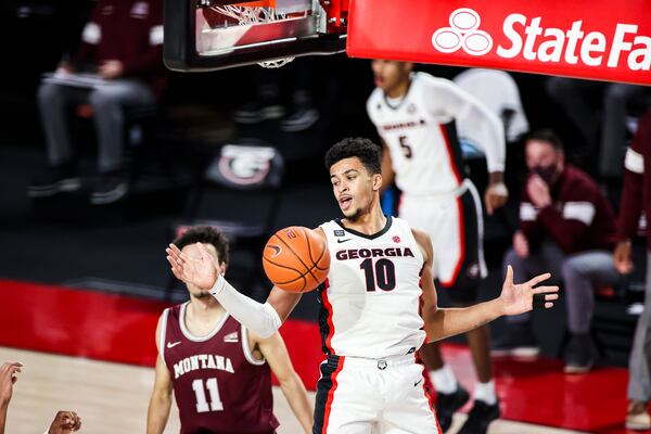 Georgia forward Toumani Camara (10) returns to Earth after yet another dunk for the Bulldogs in a 63-50 win over Montana at Stegeman Coliseum in Athens, Ga., on Tuesday, Dec. 8, 2020. (Photo by Tony Walsh)