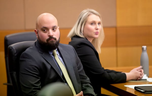 Defense attorney Scott Grubman, left, listens to court proceedings during a pre-trial hearing Monday in the case of Jenna Garland, a former press secretary to former Atlanta Mayor Kasim Reed. Garland has been charged with two misdemeanor counts of violating the Georgia Open Records Act. STEVE SCHAEFER / SPECIAL TO THE AJC