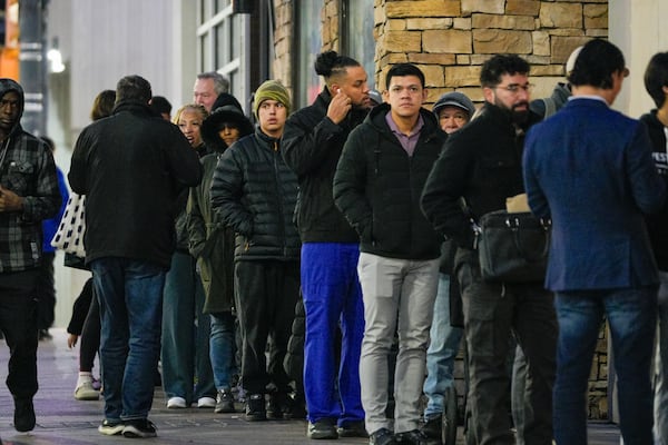 Dozens line up in the cold outside the Atlanta Passport Agency on Thursday, January 16, 2025. (Ben Hendren for the Atlanta Journal-Constitution)