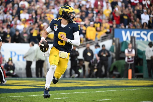 Michigan quarterback J.J. McCarthy (9) rolls out during the second half of the Rose Bowl CFP NCAA semifinal college football game against Alabama Monday, Jan. 1, 2024, in Pasadena, Calif. (AP Photo/Kyusung Gong)