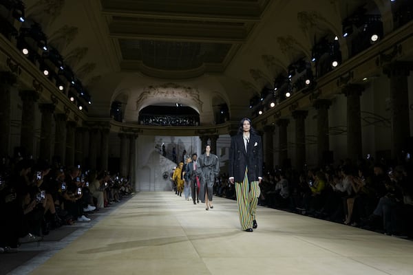 Models wear creations as part of the Vivienne Westwood Fall/Winter 2025-2026 Womenswear collection presented in Paris, Saturday, March 8, 2025. (Photo by Scott A Garfitt/Invision/AP)