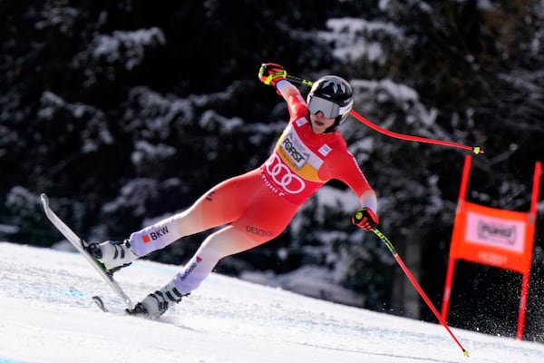 Switzerland's Lara Gut Behrami speeds down the course of an alpine ski, women's World Cup super G race, in La Thuile, Italy, Thursday, March 13, 2025. (AP Photo/Piermarco Tacca)