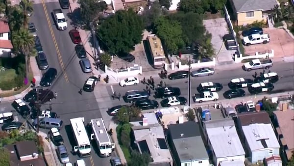 A 10-year-old San Diego boy armed with a shotgun was arrested Thursday after police said he fired two rounds at officers after barricading himself inside a shed in his backyard, according to police and news reports.