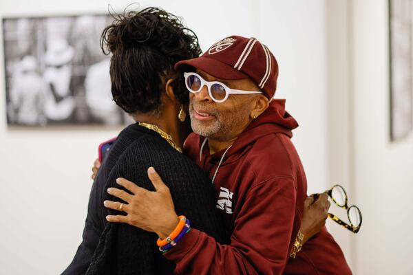 LaTanya Richardson Jackson (left), actress and wife of the renowned actor Samuel L. Jackson, embraces film director Spike Lee at Spelman College on Thursday, Oct. 24, 2024, moments before the unveiling of the newly renovated Performing Arts Center dedicated to the Jacksons. (Miguel Martinez/AJC)