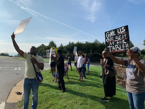 About 20 people protested Trilith Studios and the development over alleged racial discrimination on Sept. 6, 2022. RODNEY HO/rho@ajc.com