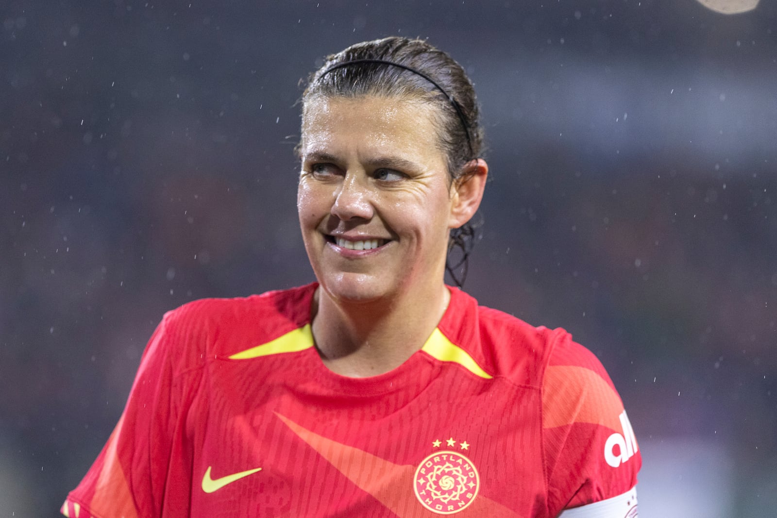 Portland Thorns forward Christine Sinclair smiles toward a young fan in the stands during the first half of an NWSL soccer match against Angel City FC at Providence Park on Friday Nov. 1, 2024 in Portland, Ore. (Sean Meagher/The Oregonian via AP)