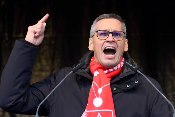 Thorsten Gröger, District Manager of IG Metall union, speaks at a rally during at nationwide warning Volkswagen workers' strike, on the grounds of the main Volkswagen plant in Wolfsburg, Germany, Monday, Dec. 2, 2024. (Julian Stratenschulte/Pool Photo via AP)