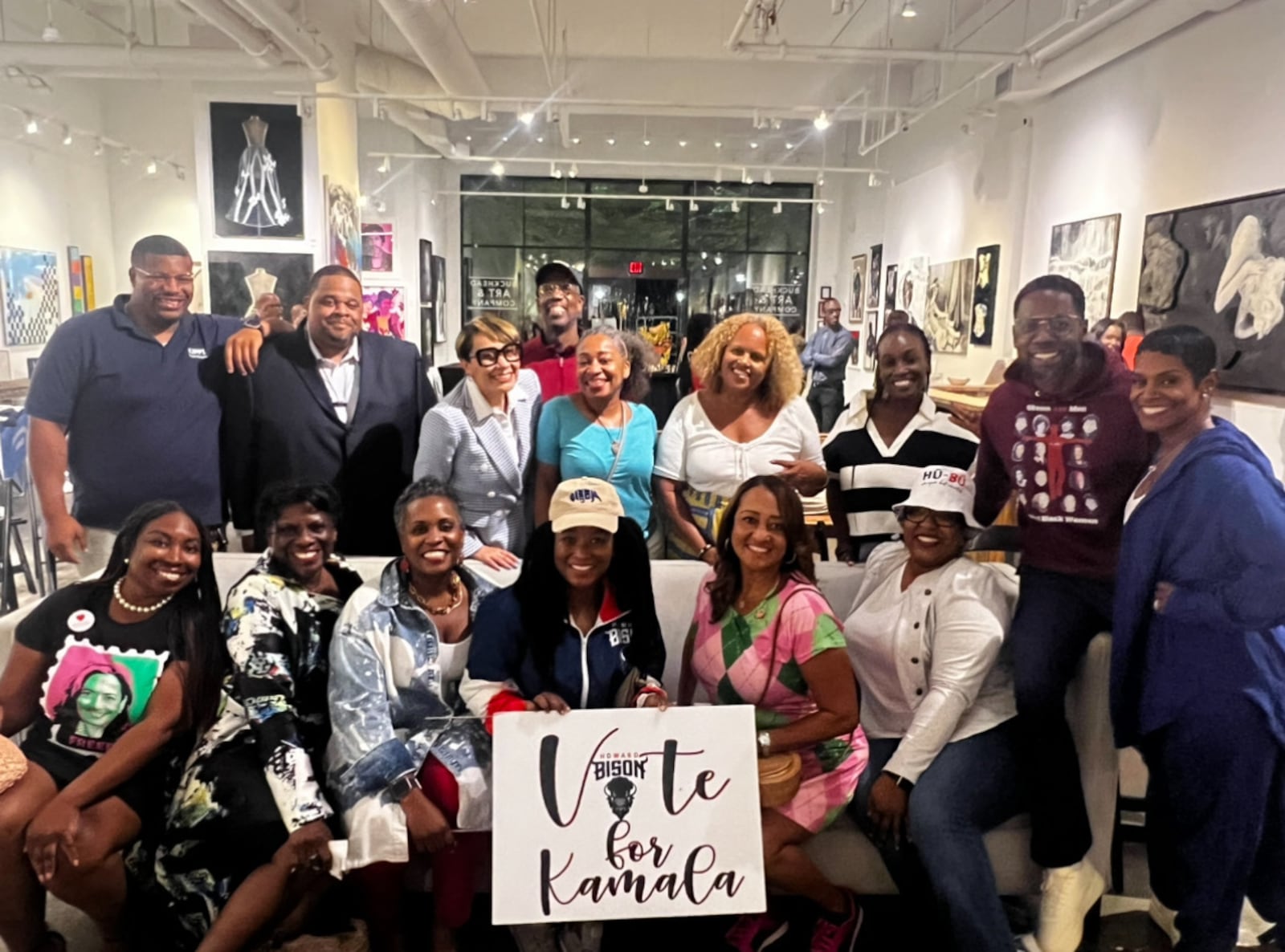 Howard Alums -- including Shanikka Wagner (front row in Kamala Harris stamp shirt); Atlanta chapter President Erin White (seated third from the left); and Melanie Felton (seated in argyle dress) -- show support for Democratic presidential nominee Kamala Harris at a viewing party for the presidential debate. Courtesy of Melanie Felton