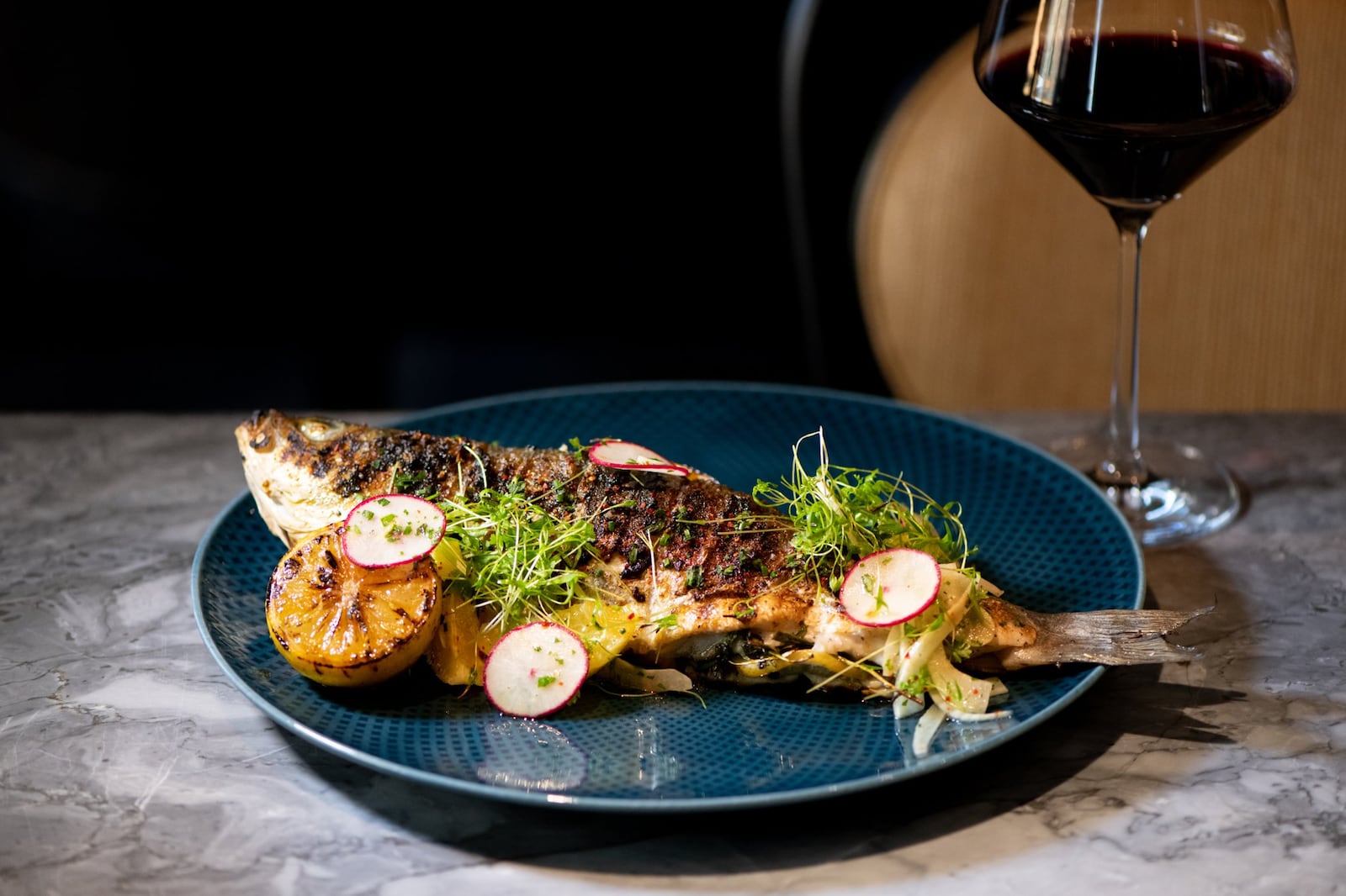 Fia offers grilled whole branzino with soft herbs and fennel-citrus salad. CONTRIBUTED BY MIA YAKEL