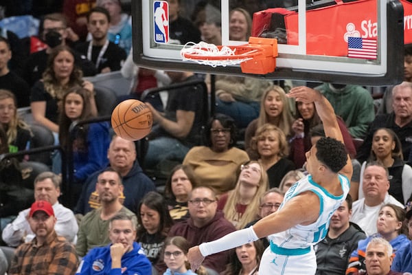 Charlotte Hornets' Cody Martin dunks against the Cleveland Cavaliers during the first half of an NBA basketball game in Cleveland, Sunday, Nov 17, 2024. (AP Photo/Phil Long)