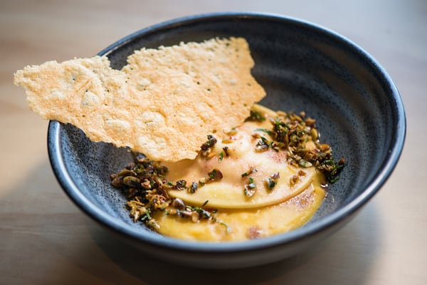 Butternut Squash Ravioli with white bean, pumpkin seed picata, Parmesan crisp, and brown butter. Photo credit- Mia Yakel.