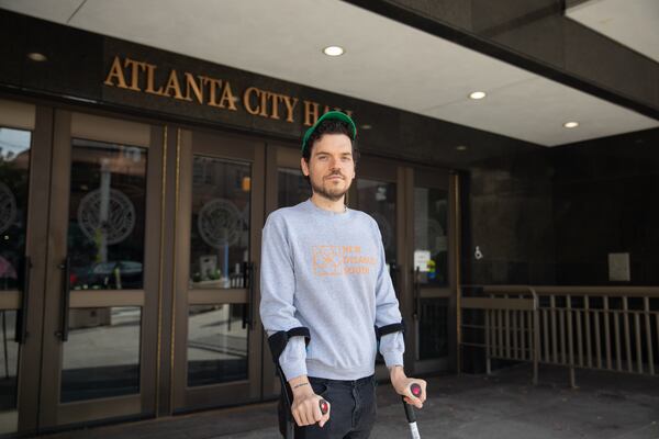 Dom Kelly, co-founder and CEO of advocacy organization New Disabled South poses for a portrait outside of Atlanta City Hall after a press conference on Oct. 30, 2024. Riley Bunch/AJC