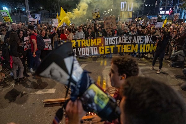 People take part in a protest in Tel Aviv, Israel, Saturday, March 8, 2025, demanding the immediate release of hostages held by Hamas in the Gaza Strip. (AP Photo/Ariel Schalit)