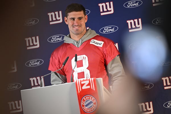 New York Giants quarterback Daniel Jones (8) attends a news conference after a practice session in Munich, Germany, Friday, Nov. 8, 2024. The New York Giants are set to play the Carolina Panthers in an NFL game at the Allianz Arena in Munich on Sunday. (AP Photo/Lennart Preiss)