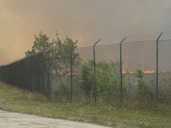 This photo provided by shows smoking from fires on Miami-Dade side fill the sky on Card Sound Road heading to the Florida Keys on Tuesday, March 18, 2025. (Monroe County Board of County Commissioners via AP)