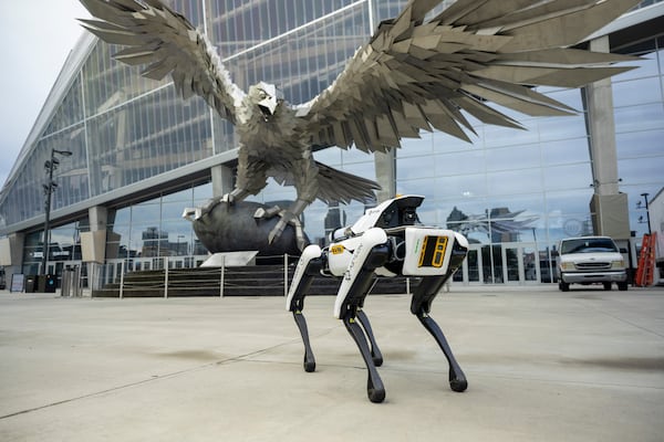 The robotic dog secures the exterior of Mercedes Benz Stadium, Thursday, August 10, 2023, in Atlanta. This robot is a new addition to the security of the stadium, patrolling the exterior at night. (Jason Getz / Jason.Getz@ajc.com)