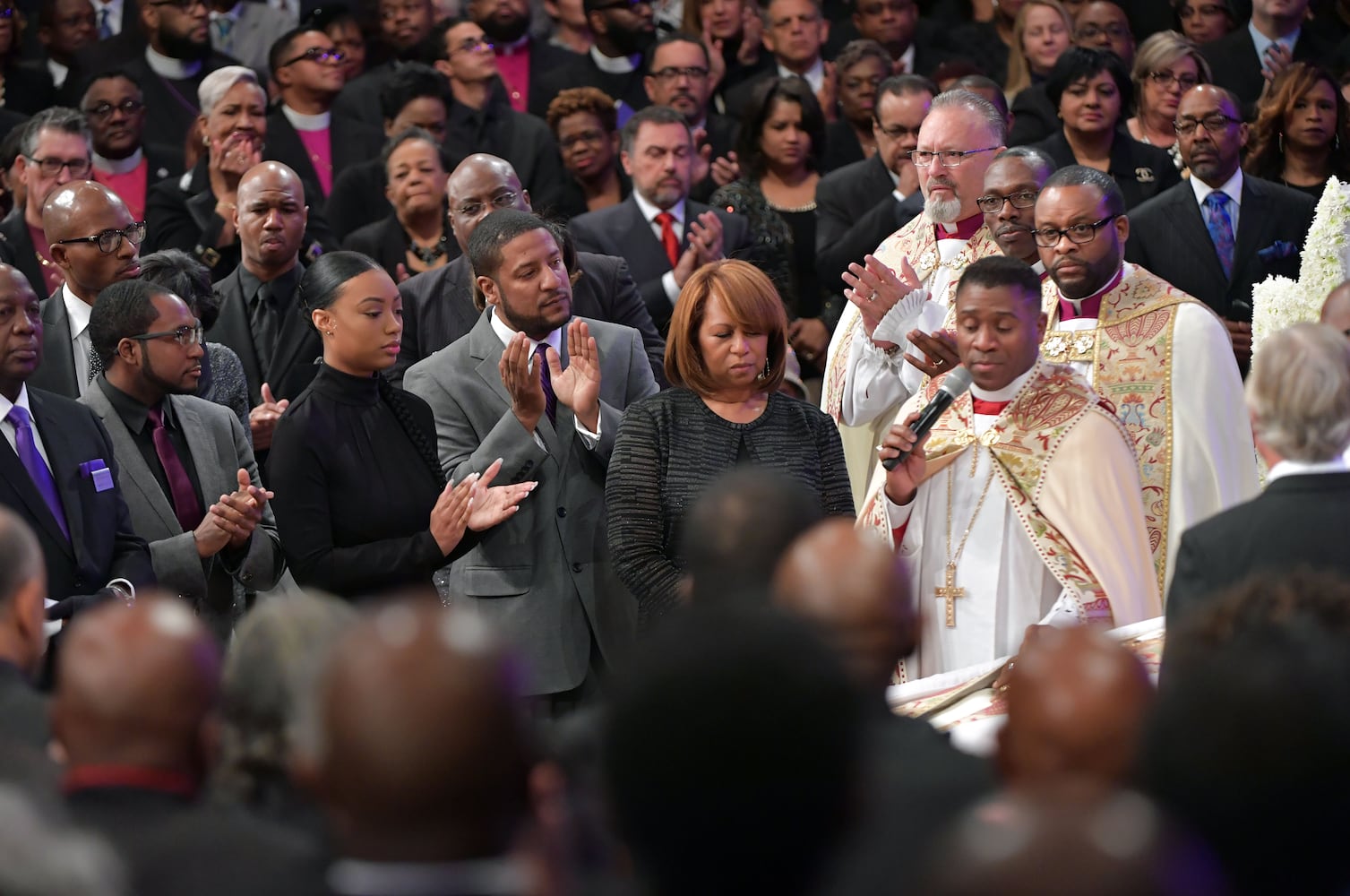 Mourners attend the funeral of Bishop Eddie Long