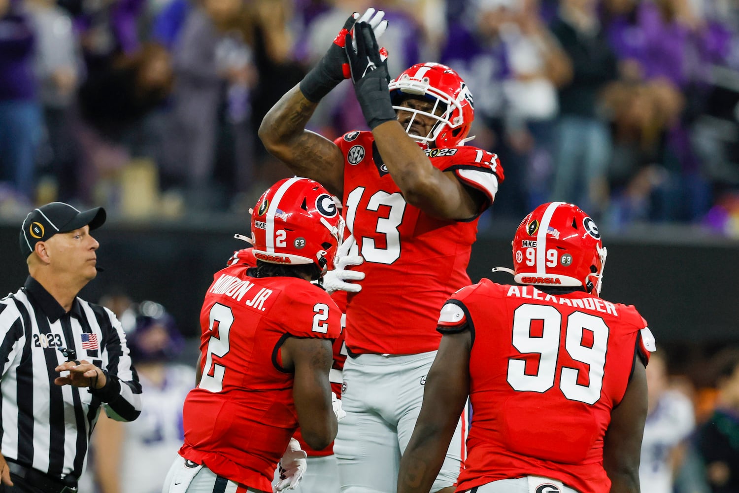 Georgia Bulldogs defensive lineman Mykel Williams (13) celebrates sacking TCU Horned Frogs quarterback Max Duggan during the first half of the College Football Playoff National Championship at SoFi Stadium in Los Angeles on Monday, January 9, 2023. (Jason Getz / Jason.Getz@ajc.com)