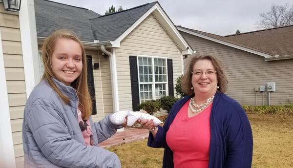 Bryn with nurse Sherry Domah who helped her with the project and will continue to make 'Tiny Hugs' for hospitals that need them. Courtesy of Bryn Hammock.