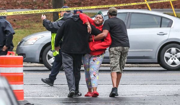 Charles Calhoun’s daughter, Chelsea, screams at Clayton County police, “You killed my father,” as she's pulled away from the scene March 23.